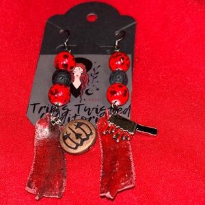 Halloween horror themed bloody knife earrings with pumpkins